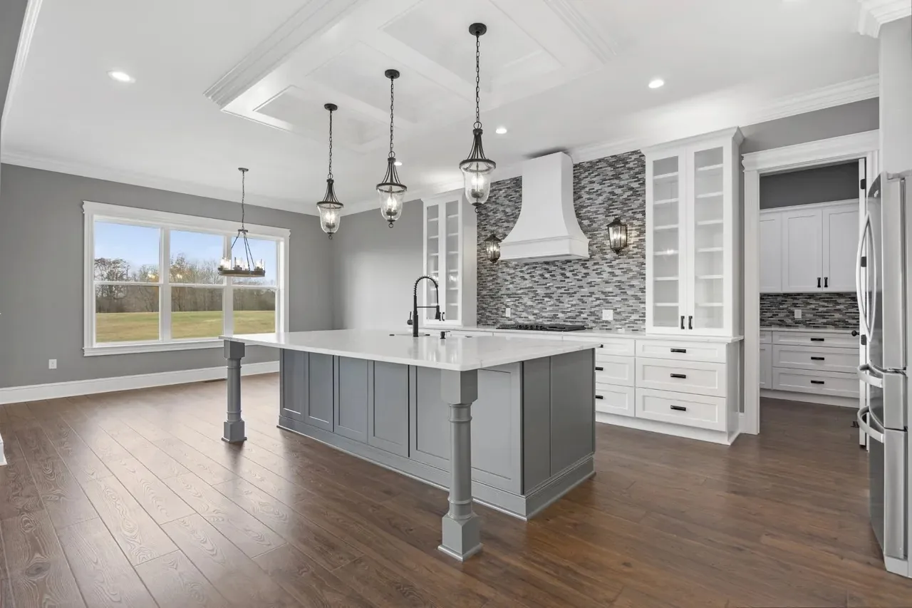 Grey and white custom kitchen with coffered ceiling, built by Holman's Custom Cabinets